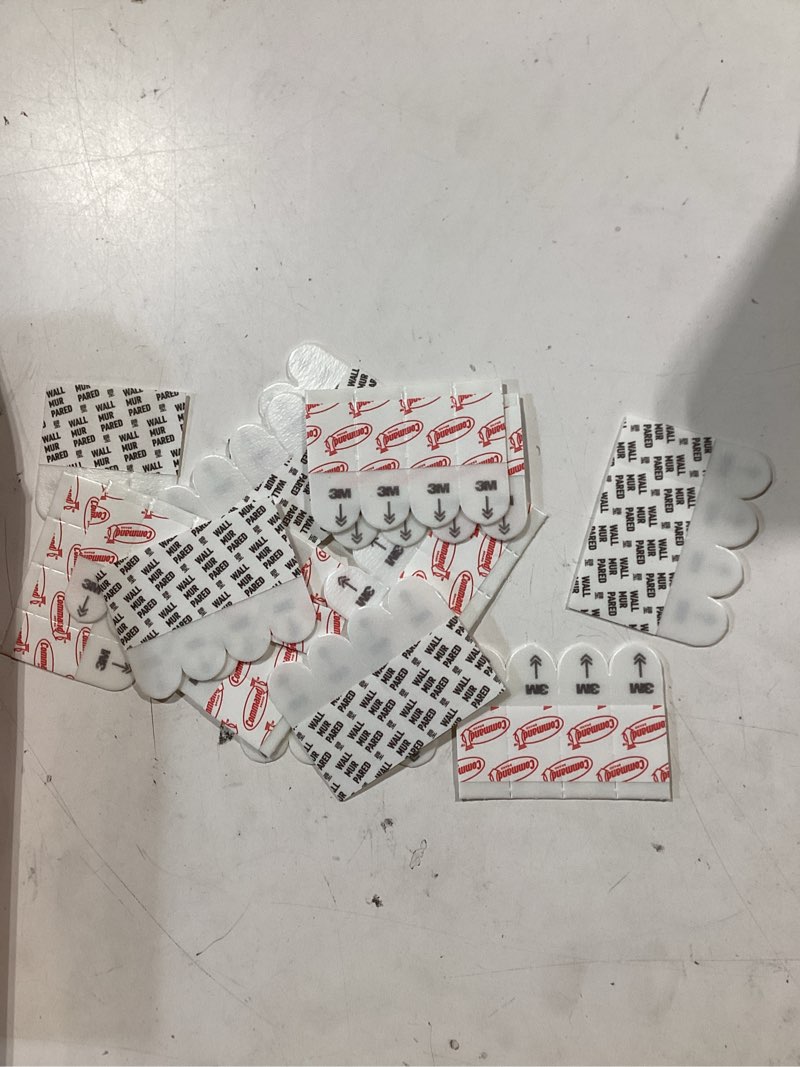 Condition photo showing As Is for command poster hanging strips, small, white, indoor use, 64-strips, decorate damage-free