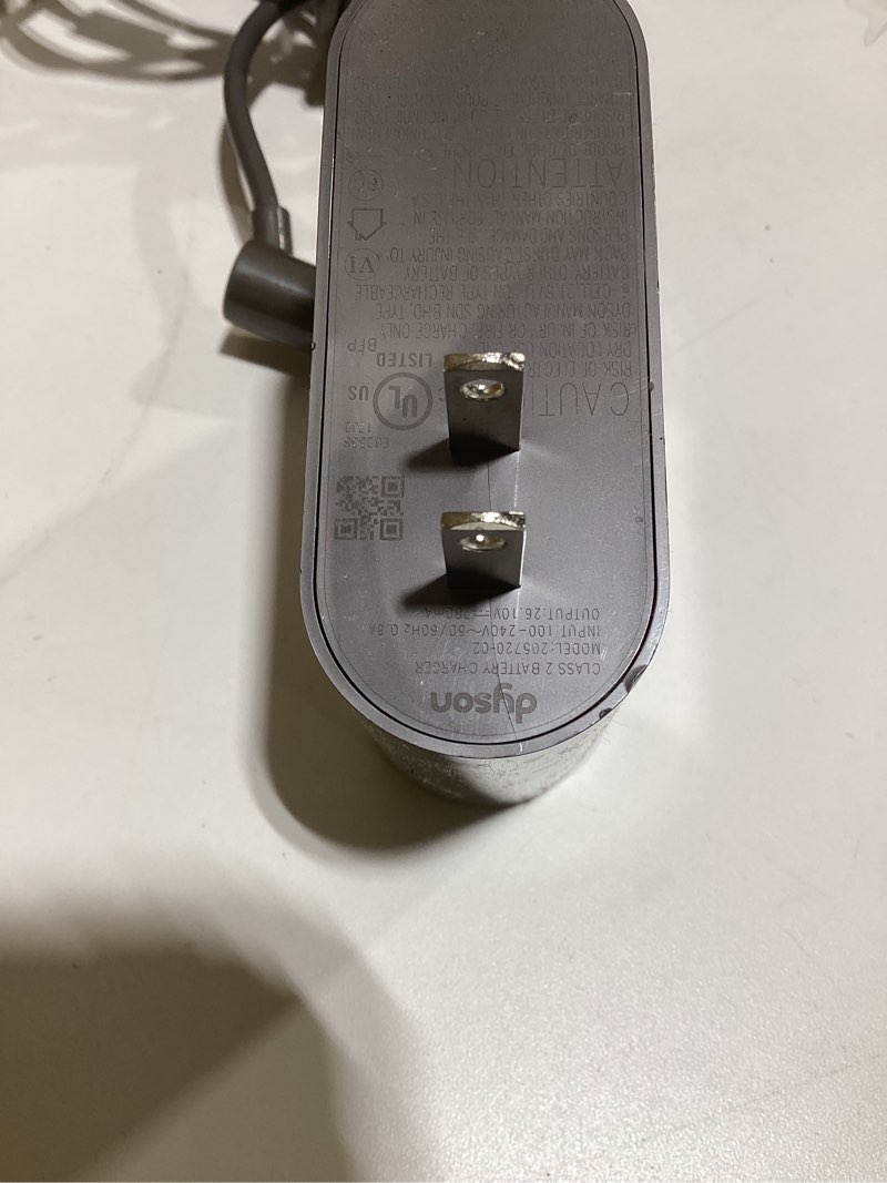 Condition photo showing As Is for dyson charger 205 720-02