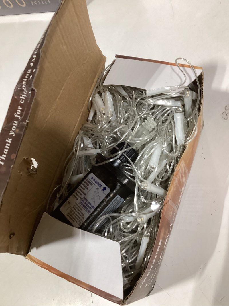 Condition photo showing Good Condition for JMEXSUSS Outdoor Net Lights Waterproof, 12ft x 5ft Plug in with 8 Modes Remoter, 360 LED Net Lights for for Bush Patio Christmas Tree Decor (Clear Wire, Warm White) Warm White 360 LED