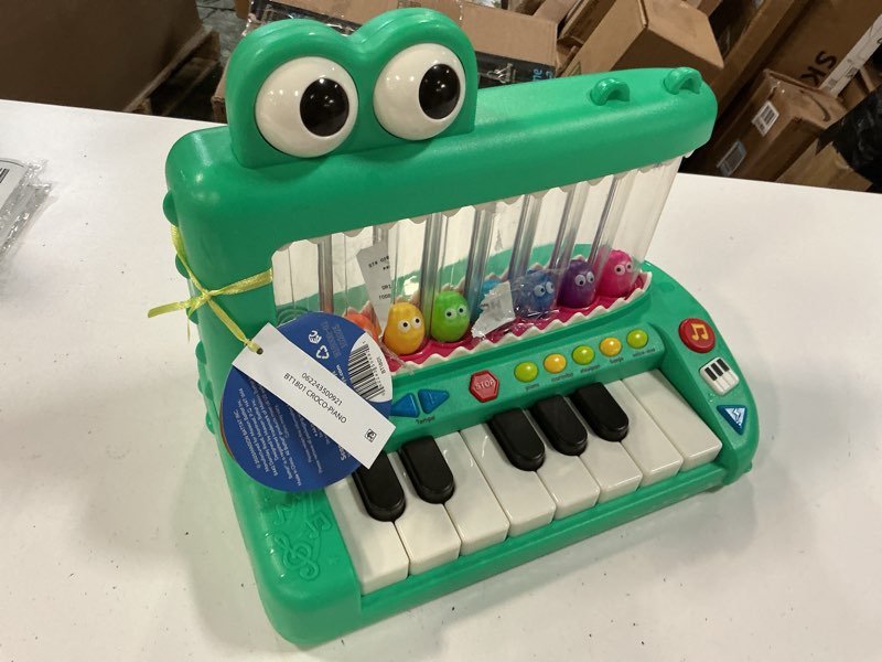 Condition photo showing As Is for battat croco pop piano toy keyboard with songs sounds lights, baby and toddler toys