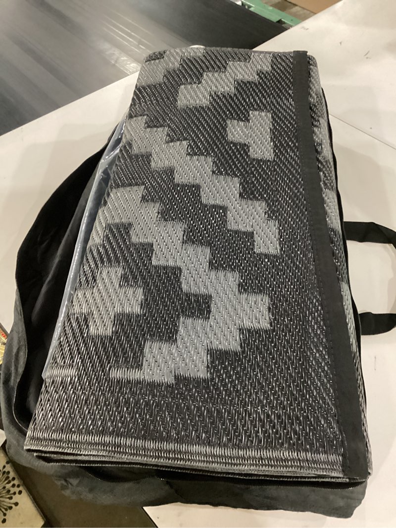 Condition photo showing Good Condition for this paco home indoor/outdoor rug, color black and dark grey