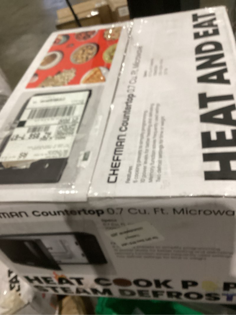 Condition photo showing As Is for Chefman Countertop Microwave Oven 0.7 Cu. Ft., 700 Watts with 10 Power Levels, 6 Cooking Presets with One-Touch Express Cook, Eco Mode, Child Safety Lock, & Mute Button - Black