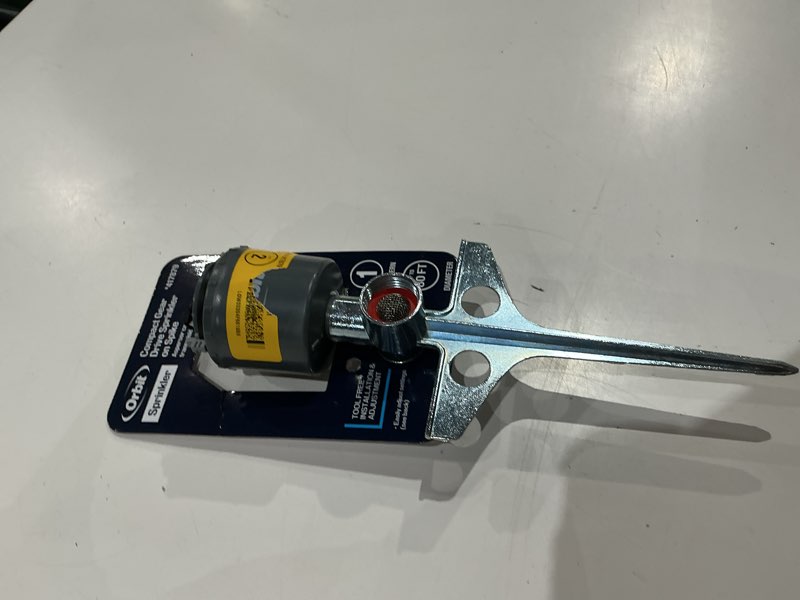 Condition photo showing As Is for orbit 5000-sq ft rotating spike lawn sprinkler