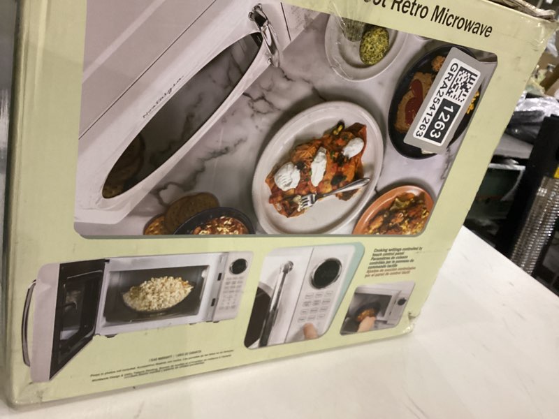 Condition photo showing As Is for Nostalgia Retro Microwave Oven - 0.7 Cu Ft, 700-Watt Countertop Size with Glass Turntable, Child Safety Lock, 8 Auto-Cook Programs, Digital Clock - White 0.7 Cu. Ft. White
