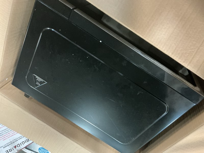 Condition photo showing As Is for Frigidaire EMW112OAMZ Stainless Steel Microwave Oven, Multi Function, Programmable, 1.1 Cu Ft 1000-Watt, residential kitchen, Stainless