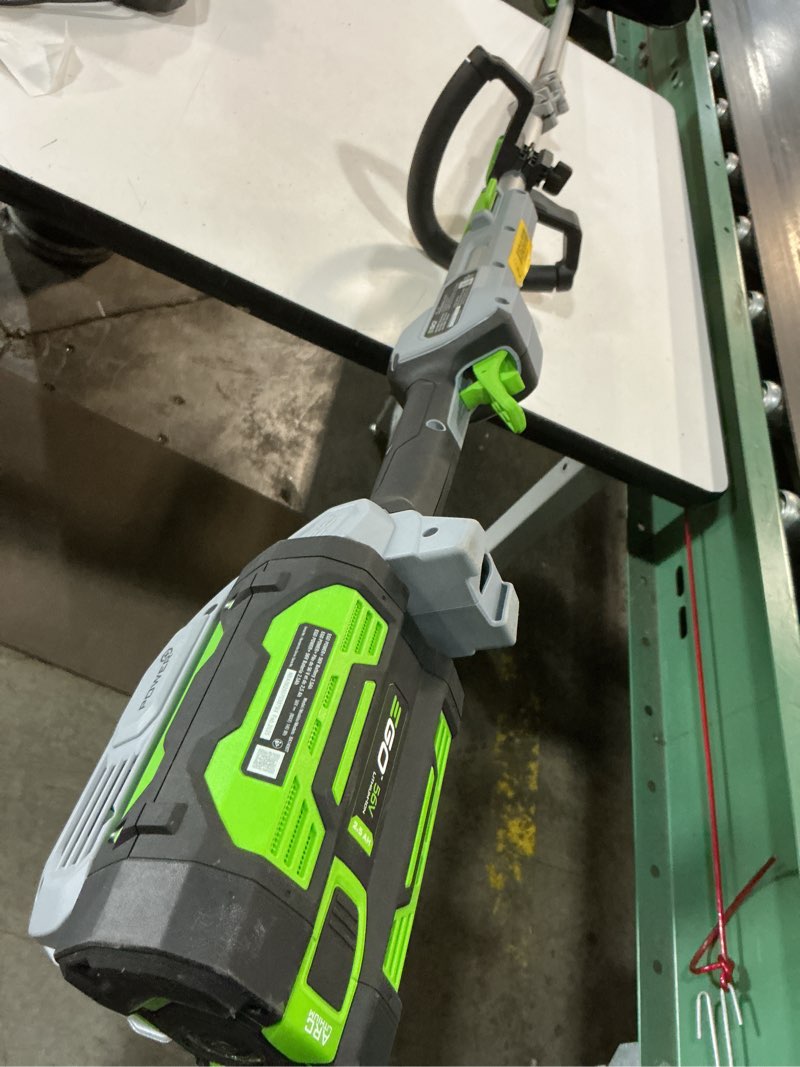 Condition photo showing As Is for ego power+ mhc1603 multi-head combo kit 16-inch 56-volt carbon fiber string trimmer with powerload & 8-inch carbon fiber edger attachment & 56-volt power head, 4.0ah battery and 320w charger included combo carbon fiber combo kit, w/4.0ah battery