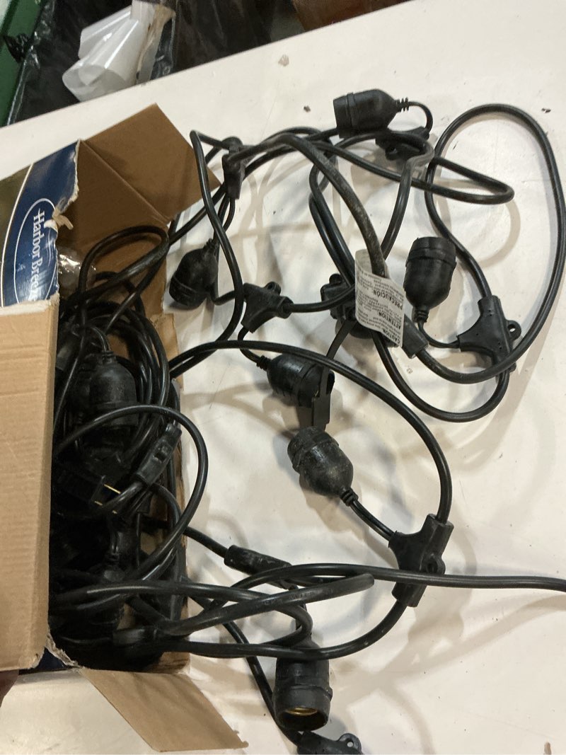 Condition photo showing As Is for harbor breeze 48-ft plug-in black indoor/outdoor string light with 24 white -light led edison bulbs