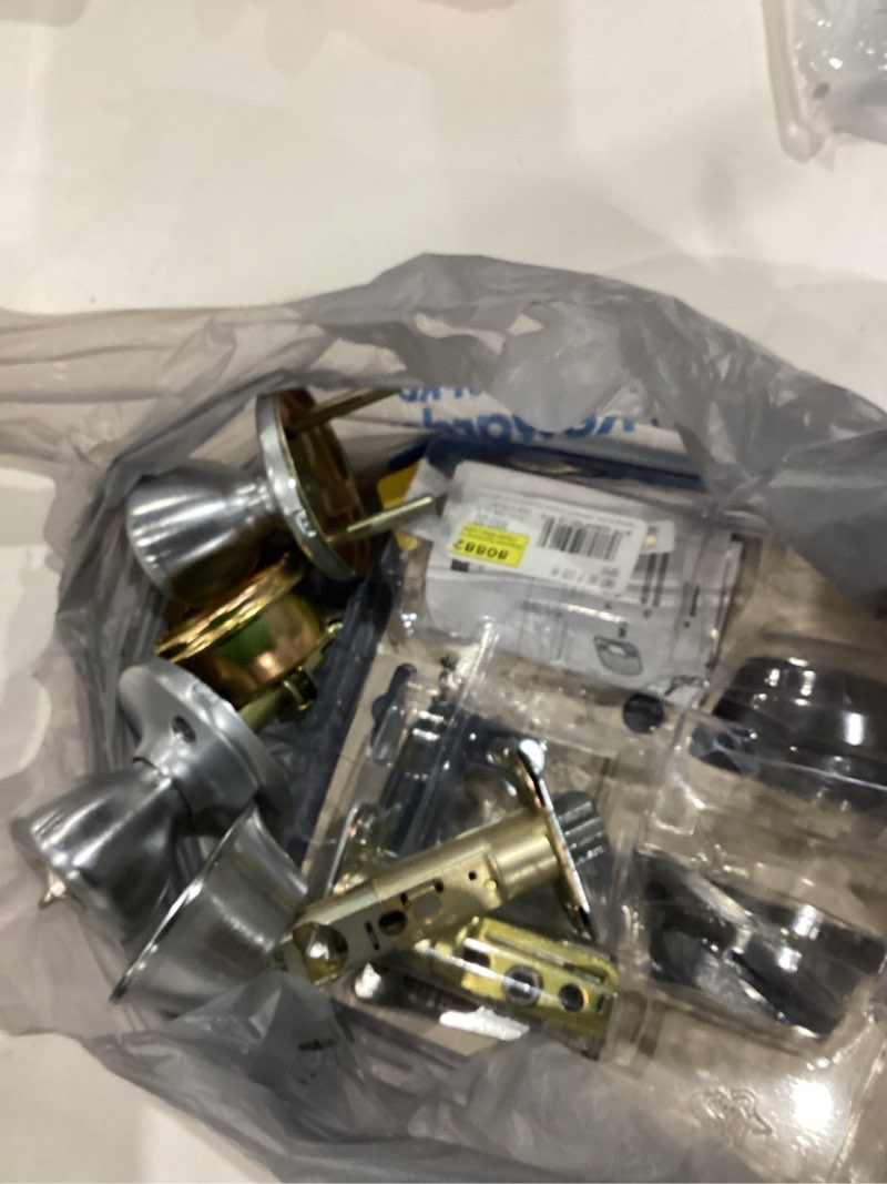 Condition photo showing As Is for kwikset tylo satin chrome exterior single-cylinder deadbolt and keyed entry door knob combo