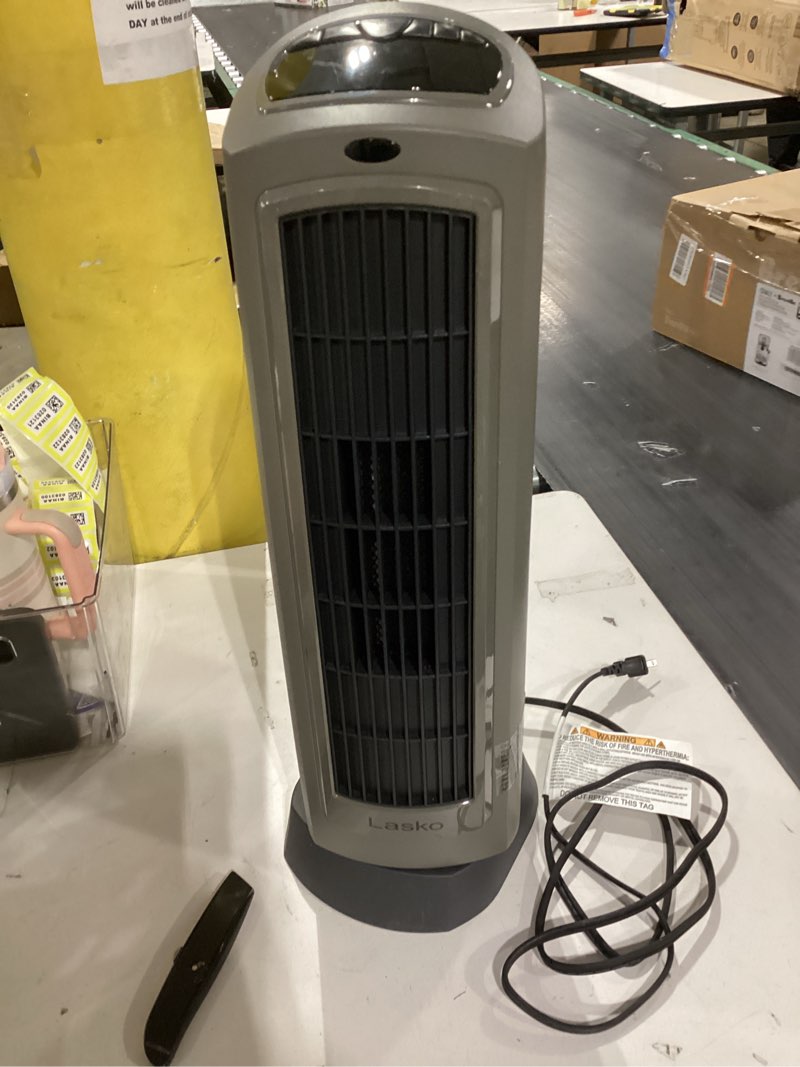 Condition photo showing Good Condition for lasko oscillating digital ceramic tower heater for home with adjustable thermostat, timer and remote control, 23 inches, 1500w, silver, 755320 silver heater