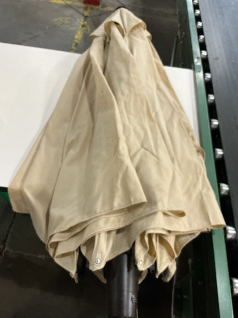 Condition photo showing As Is for california umbrella 9-ft aluminum beige auto-tilt market patio umbrella