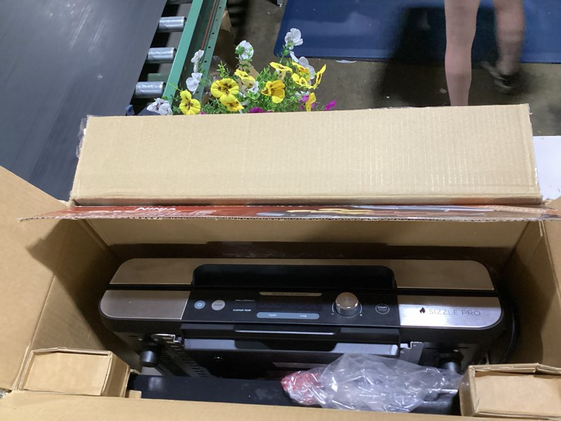 Condition photo showing As Is for ninja sizzle pro xl 20-inch indoor griddle + grill, detachable ventilated lid, grease control, ceramic nonstick plates, even edge cooking, extra large capacity, versatile, silver, gx101