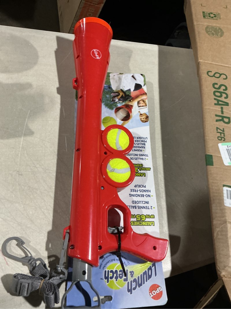 Condition photo showing Good Condition for spot launch & fetch tennis ball launcher dog toy | interactive dog fetch toy launches up to 65 feet | hands-free pickup | includes 2 tennis balls & removable shoulder strap | 24"