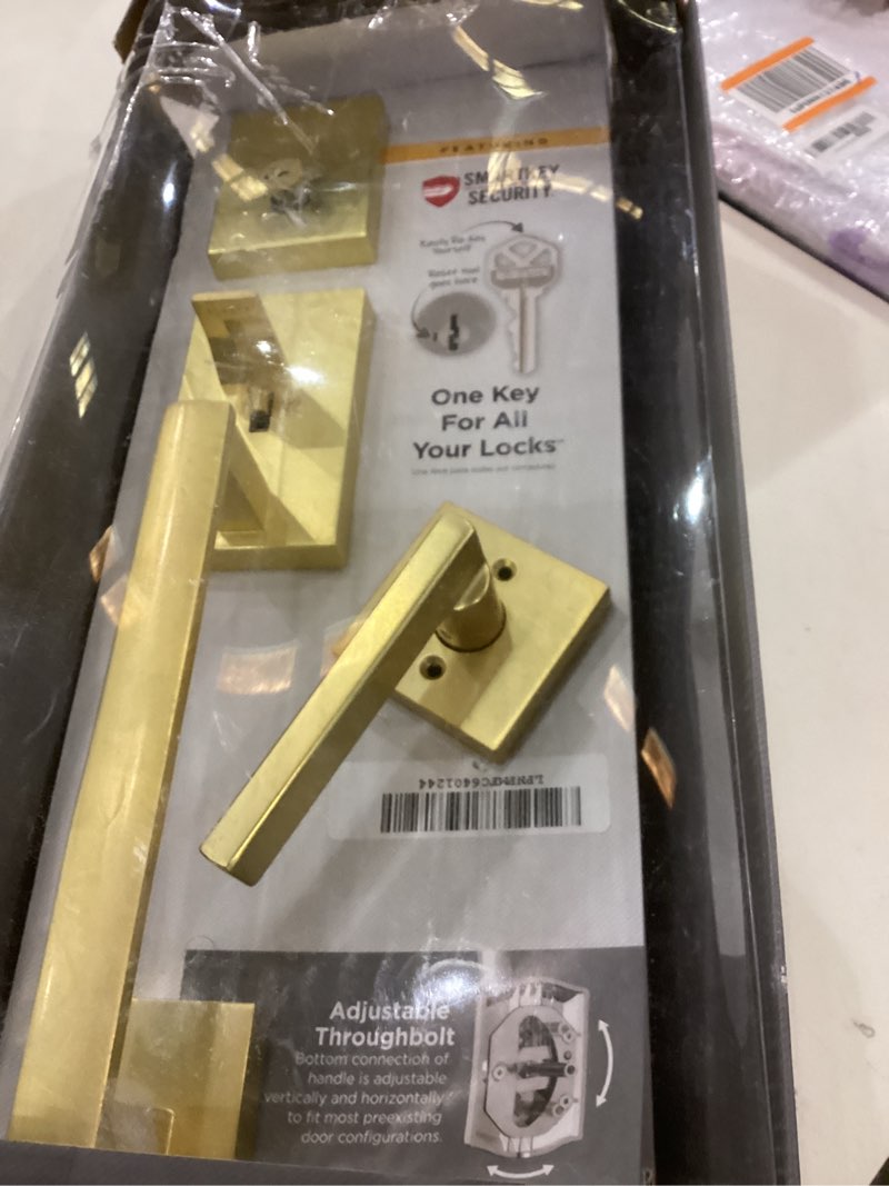Condition photo showing As Is for Kwikset San Clemente Front Door Lock Handle and Deadbolt Set, Entry Handleset Exterior with Interior Reversible Lever, Satin Brass, Pick Resistant SmartKey Deadbolt Security, with Microban Protection Satin Brass With Handle Keyed Entry