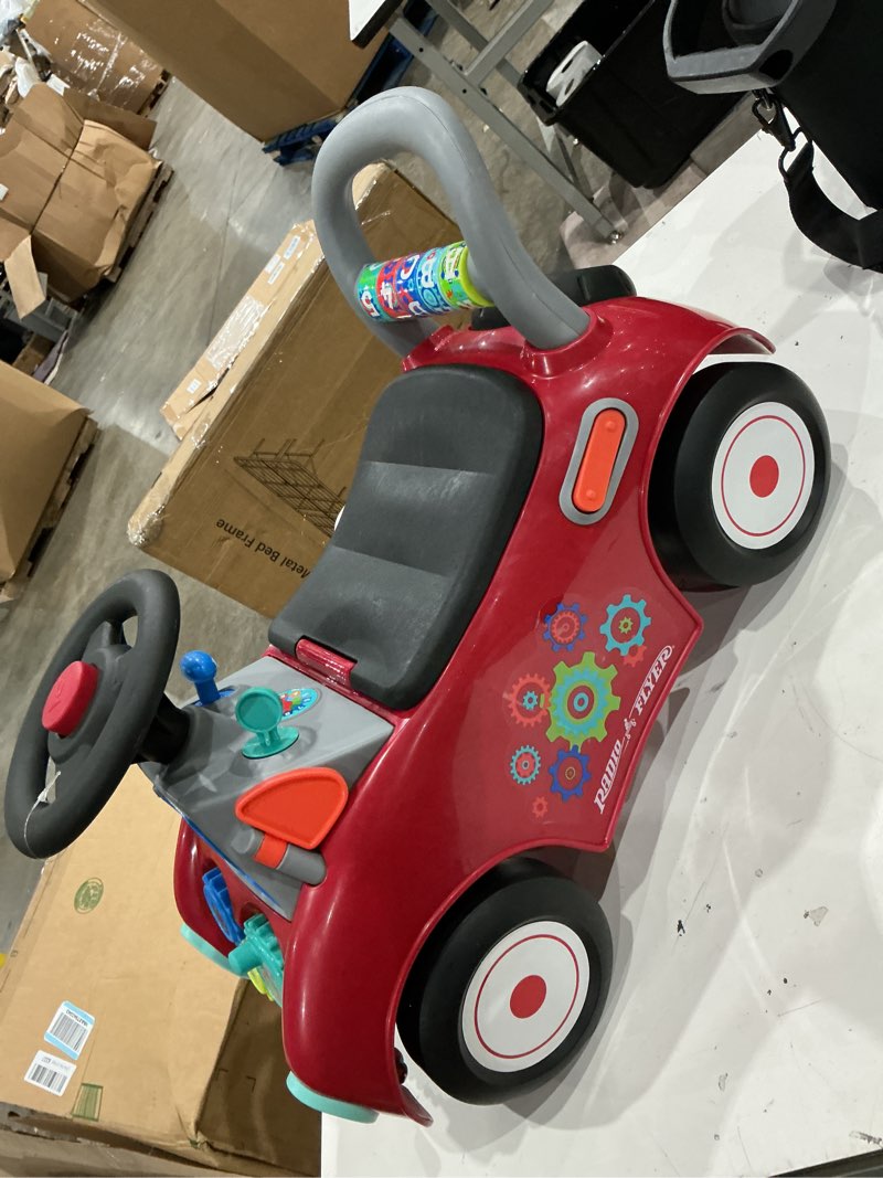 Condition photo showing Good Condition for radio flyer busy buggy, for toddlers 1-3, 3-in-1 push walker ride on car with 17 sensory activities, anti-tip feature, under-seat storage, horn and gears, 42 lb capacity, toddler ride on toys red
