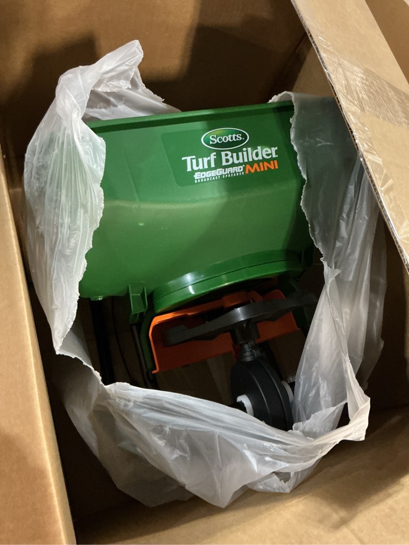Condition photo showing Good Condition for scotts turf builder edgeguard mini broadcast spreader for seed, weed and feed, fertilizer, salt, ice melt, push spreader holds up to 5,000 sq.ft. product