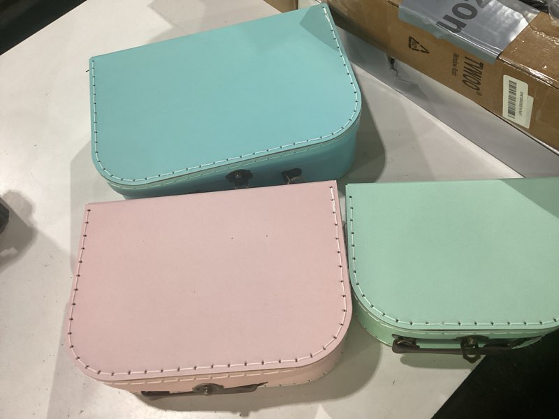 Condition photo showing New/Like New for jewelkeeper vintage suitcase storage boxes - 3 sizes: small (8x6x3 in), medium (10x7x3.2 in), large (11.5x7.5x3.75 in) - baby pink, stackable, sturdy cardboard - perfect for decor, storage, or gifts