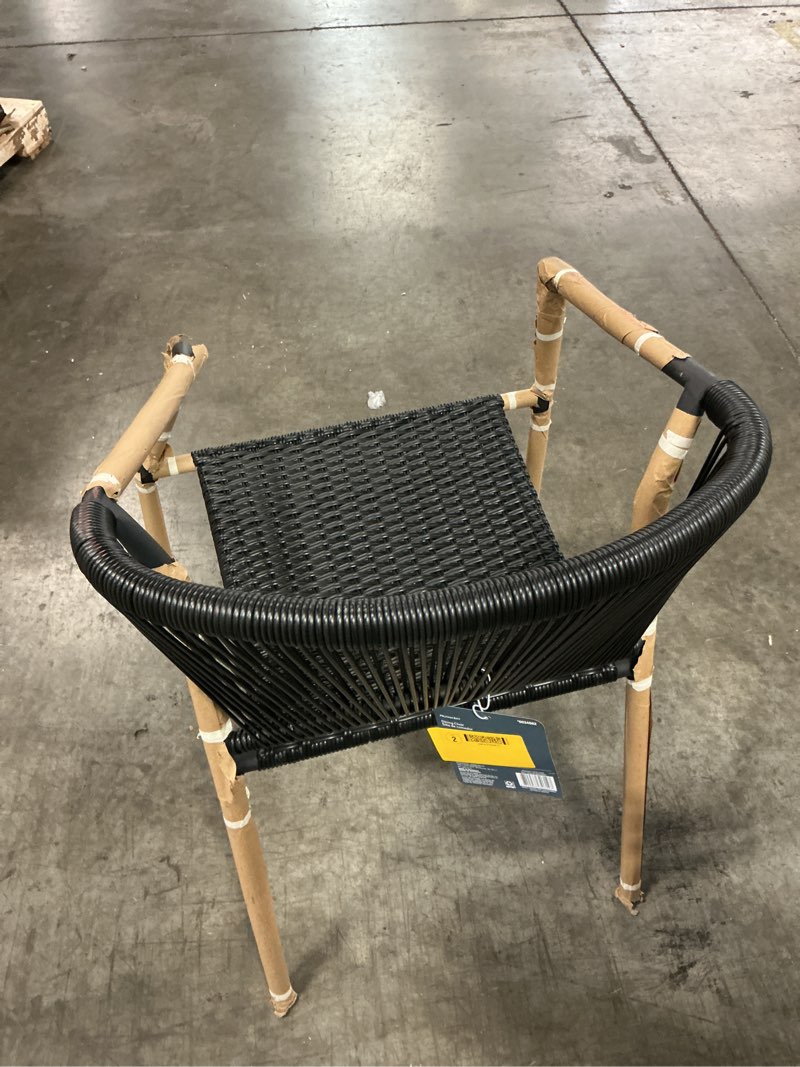 Condition photo showing As Is for  style selections pelham bay wicker stackable black steel frame stationary dining chair with