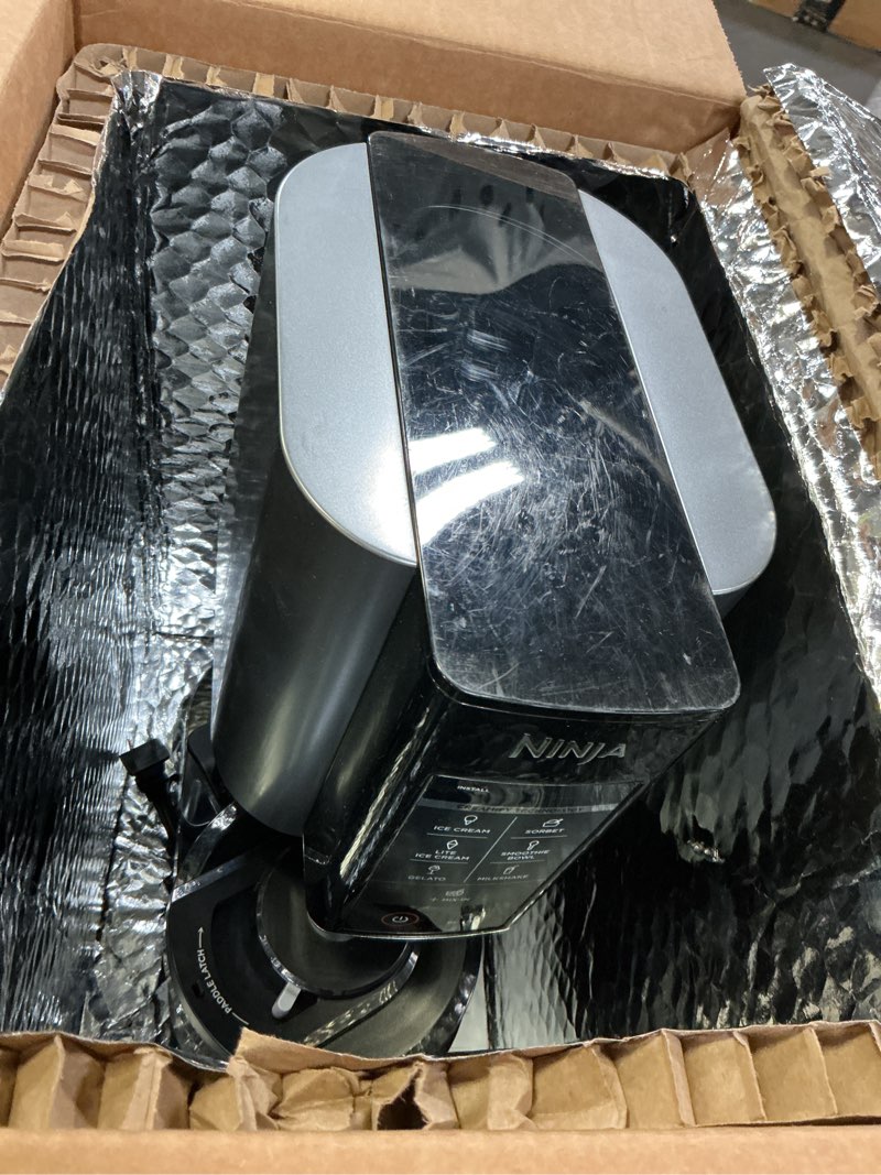 Condition photo showing As Is for Ninja CREAMi, Ice Cream Maker, Ice Cream, Gelato, Sorbet,Milkshakes, Mix-ins, Smoothie Bowls & More, 7-in-1, Ice Cream Pints, Pint lid, Healthy Ice Cream, Compact, Perfect for Kids, Black, NC299AMZ Ninja CREAMi 7-in-1