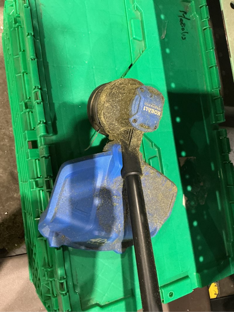 Condition photo showing As Is for has battery and charger in cage)))kobalt gen4 40-volt cordless battery string trimmer and leaf blower and combo kit 4.0 ah (battery included) (charger included)