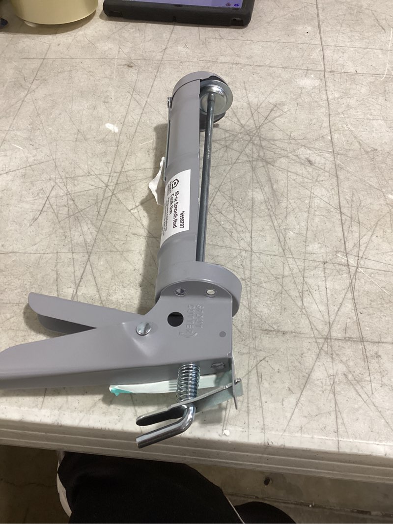 Condition photo showing As Is for project source 10 -oz smooth rod caulk gun