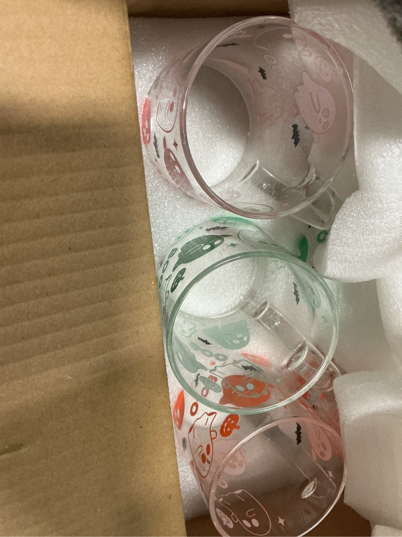 Condition photo showing New/Like New for CHENGU 12 Pcs Halloween Glass Coffee Mugs Gifts 16 oz Color Changing Ghosts Mugs Cute Ghosts Glass Cups Bulk with Handle Colorful Halloween Party Gifts for Women Men Home Bar Party Decorations 12 Halloween