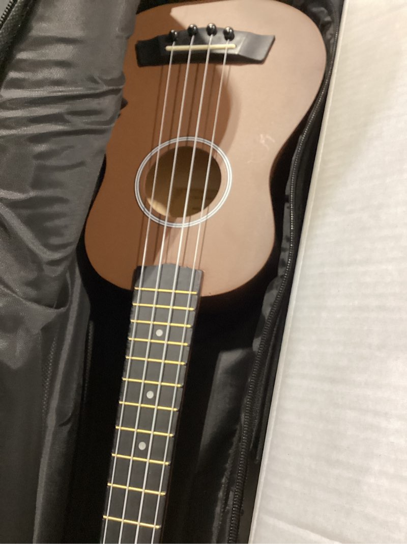 Condition photo showing Good Condition for not home soprano ukulele beginner pack, 21 inch basswood kids ukuleles starter kit with gig bag spare strings tuner and picks. (coffee) 21 inch coffee