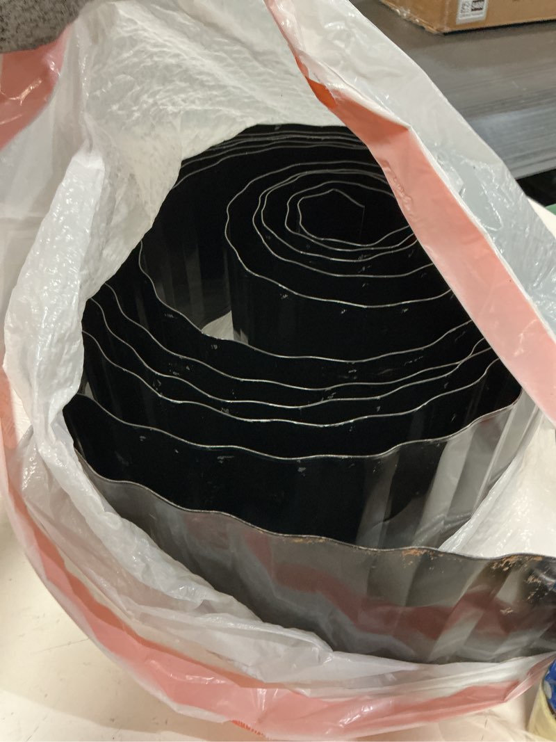 Condition photo showing As Is for land guard corrugated garden edging border, 12" x 50' landscape paver edging, tall landscape edging, fence for garden, flower bed, lawn and landscape edging (glossy black) glossy black 12 inch×50 ft