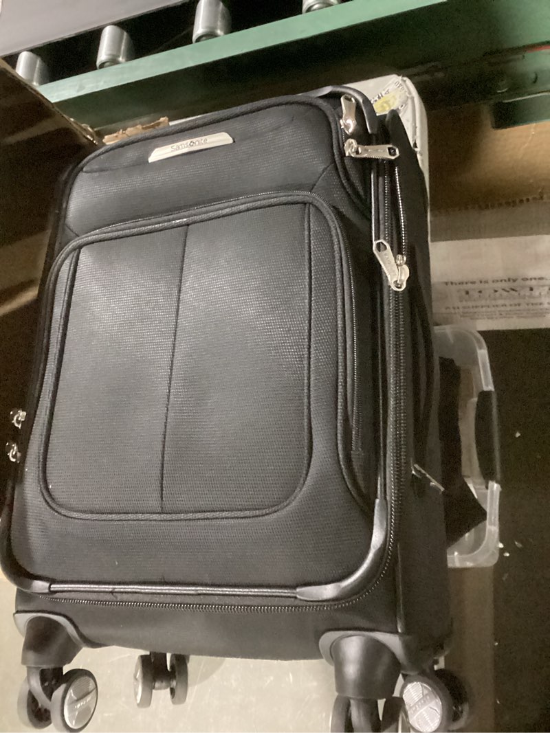 Condition photo showing New/Like New for samsonite solyte dlx softside expandable luggage with spinner wheels, midnight black, carry-on 20-inch carry-on midnight black