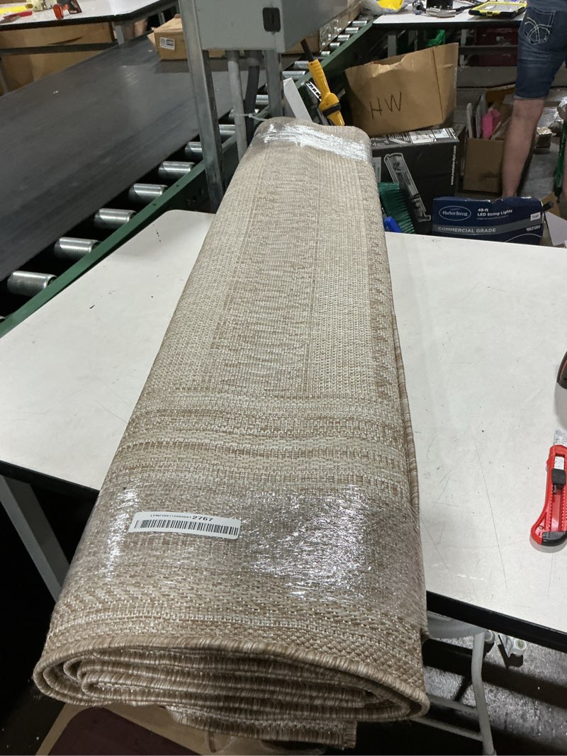 Condition photo showing As Is for gray living room rug (dimensions unknown)