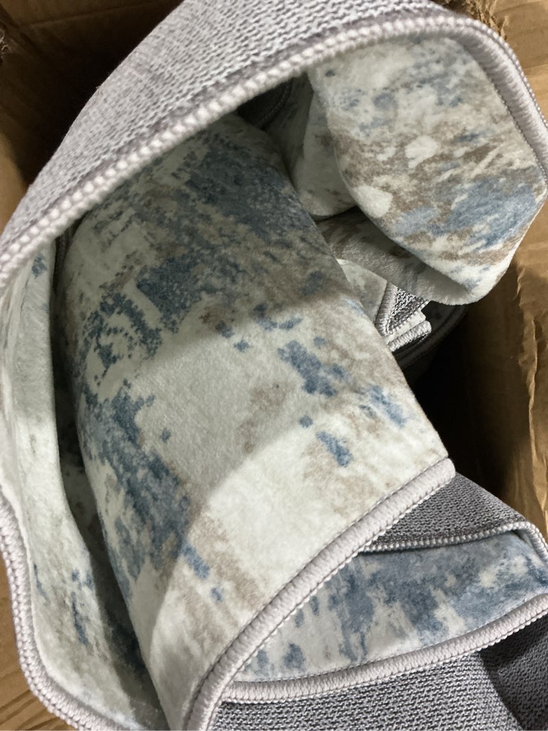 Condition photo showing As Is for (Similar to stock photo) SAFAVIEH Brentwood Collection Area Rug - 8' x 10', Navy & Light Grey, Medallion Distressed Design, Non-Shedding & Easy Care, Ideal for High Traffic Areas in Living Room, Bedroom (BNT832M) 8' x 10' Navy/Light Grey