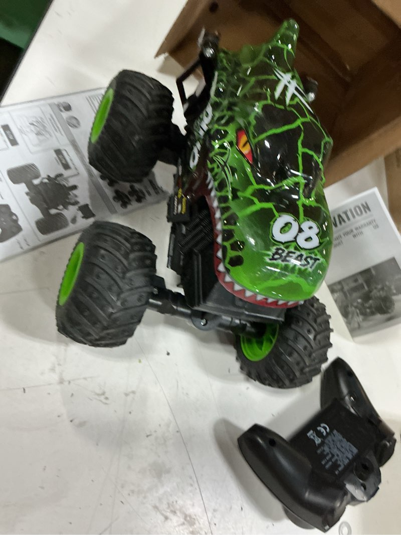 Condition photo showing As Is for bezgar monster truck toys - remote control monster truck with light & music, dinosaur toys for kids, 1:20 scale rc truck with 360° spins and drifting, remote control car for boys 4-7 green