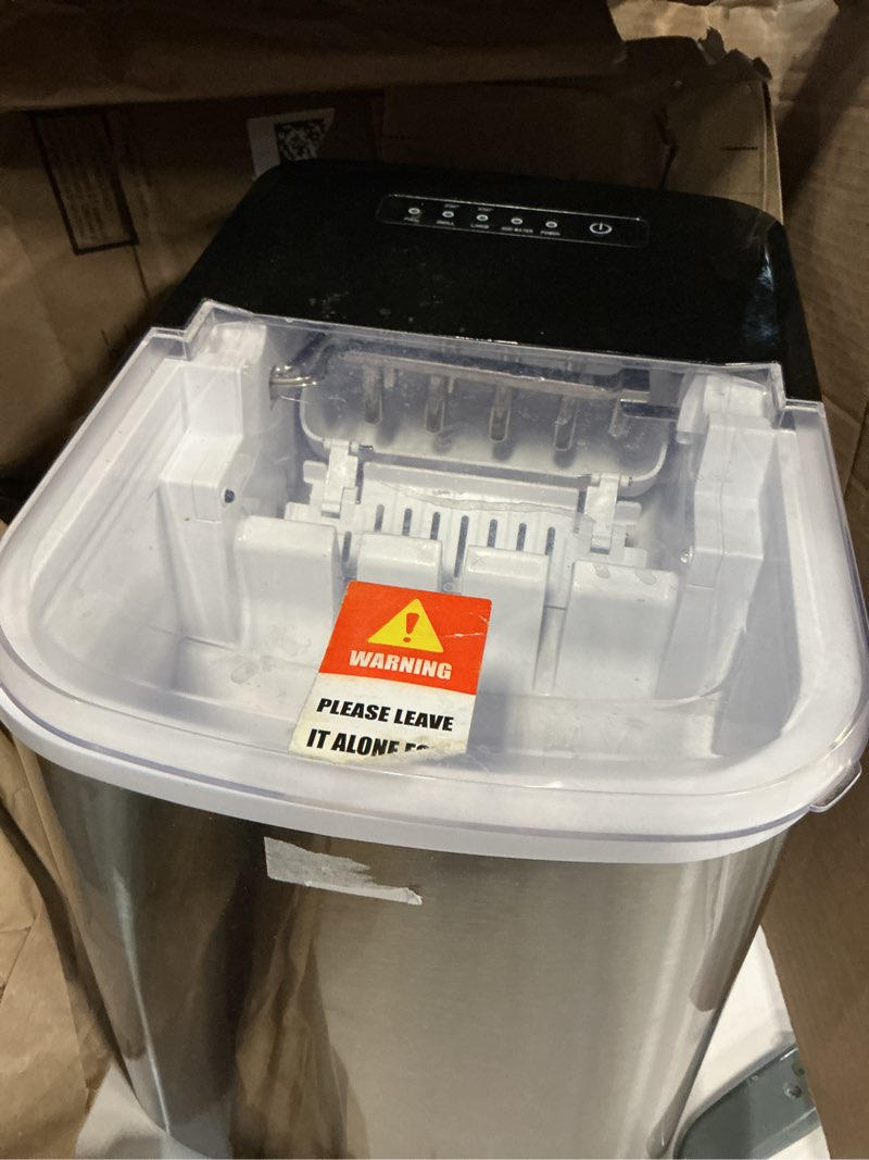 Condition photo showing As Is for RV Ultra-Compact Portable Ice Maker | Efficient Water Recycling | Automatic Shut-Off | Ideal for RVs, Picnics, Camping | ICE-50S
