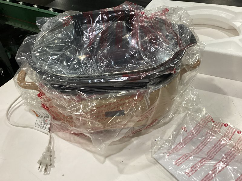 Condition photo showing New/Like New for magnifique 6 quart multi-cooker, with 8-in-1 casserole programmable slow cooker, dutch oven, pasta, nonstick, oven safe pot to 500°f brown sugar
