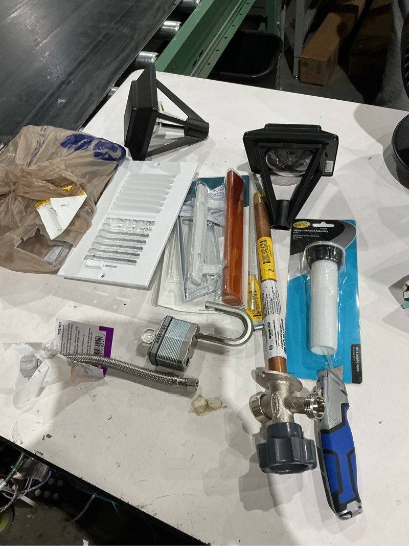 Condition photo showing As Is for assorted home improvement lot (small tools, screw, home accessories, etc.)