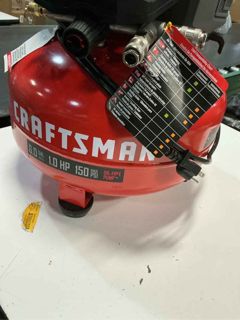 Condition photo showing As Is for craftsman 6 gallon portable pancake air compressor, oil-free, max 150 psi, 1 hp, 2.6 scfm @ 90 psi, with 25 ft air hose and 2 quick couplers, model cmxecxa0210641c