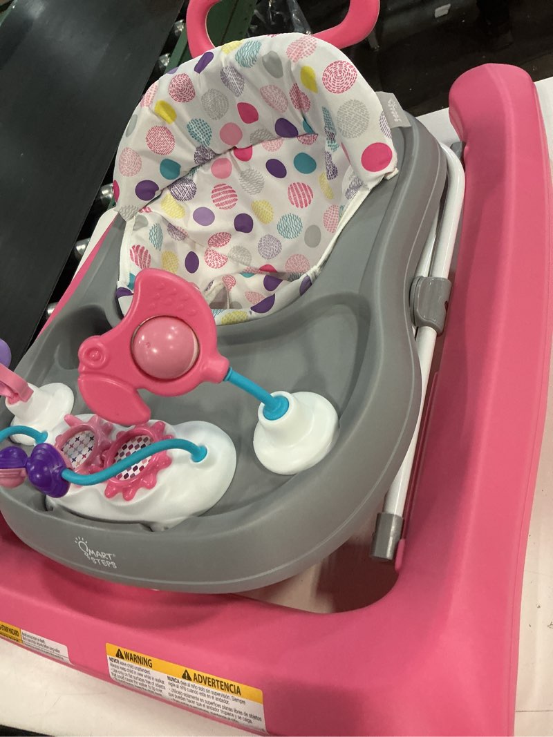 Condition photo showing As Is for smart steps trend plus 2-in-1 activity walker with deluxe removable toys, walk-behind bar, adjustable height and flat fold frame for storage, ages 6 months +, orbits pink
