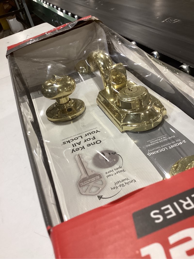 Condition photo showing As Is for kwikset signature series montara polished brass single-cylinder deadbolt keyed entry door handleset knob smartkey