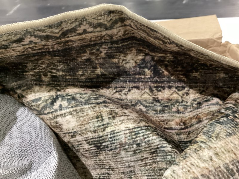 Condition photo showing As Is for large area rug 