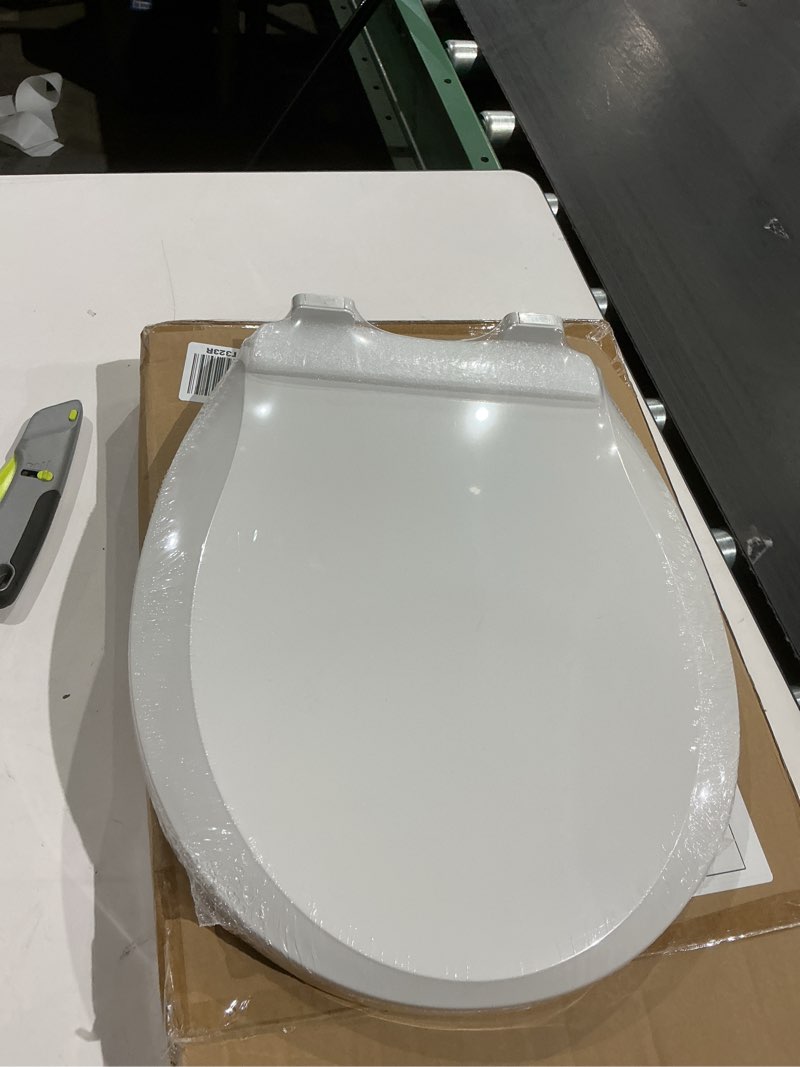 Condition photo showing New/Like New for toilet seat, round toilet seat with toddler seat built in, potty training toilet seat round fits both adult and child, with slow close and magnets- round