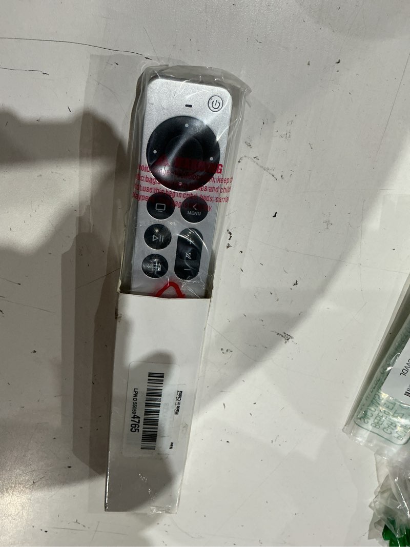 Condition photo showing As Is for replacement remote control for apple tv remote. 1-year warranty. silver