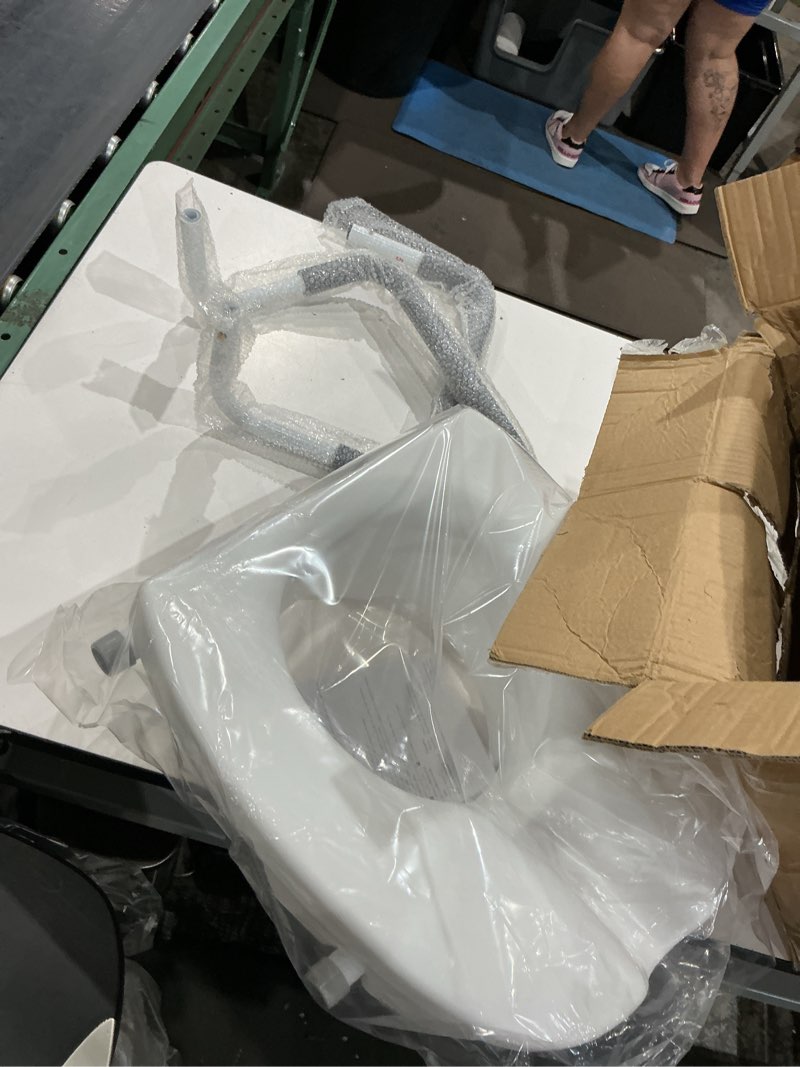 Condition photo showing As Is for raised toilet seat with handles and lid 