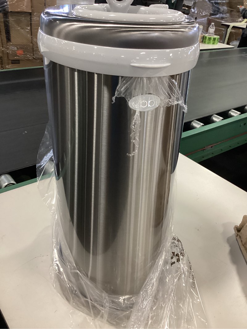 Condition photo showing As Is for ( with dent) Ubbi Steel Diaper Pail, Odor Locking, No Special Bag Required, Award-Winning, Registry Must-Have, Chrome