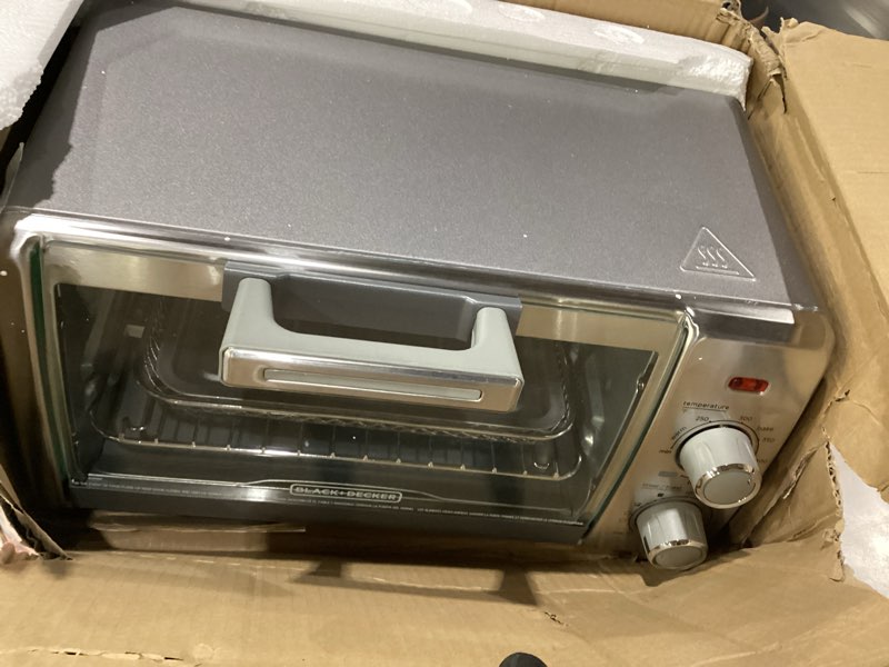 Condition photo showing As Is for black+decker crisp 'n bake air fry countertop convection toaster oven, medium capacity, 4-slice, 5-in-1, fits 9” pizza, 30-min timer, bake, broil, air fry, toast, keep warm, stainless steel, not tested, incomplete