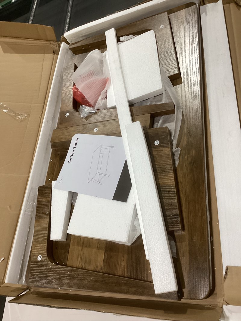 Condition photo showing New/Like New for VASAGLE MAEZO Collection - Coffee Table, 2-Tier Center Table with Storage, Tapered Legs, Curved Transitions, 21.7 x 39.4 x 17.7 Inches, Easy to Assemble, for Living Room, Honey Brown ULCT249K01