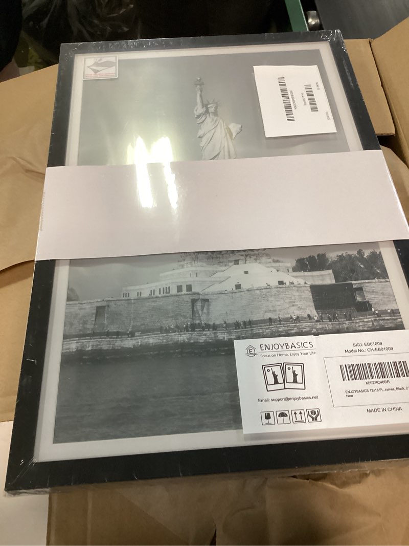 Condition photo showing New/Like New for ENJOYBASICS 12x18 Picture Frame, Display Poster 11x17 with Mat or 12 x 18 Without Mat, Wall Gallery Photo Frames, Black, 2 Pack Black 12x18