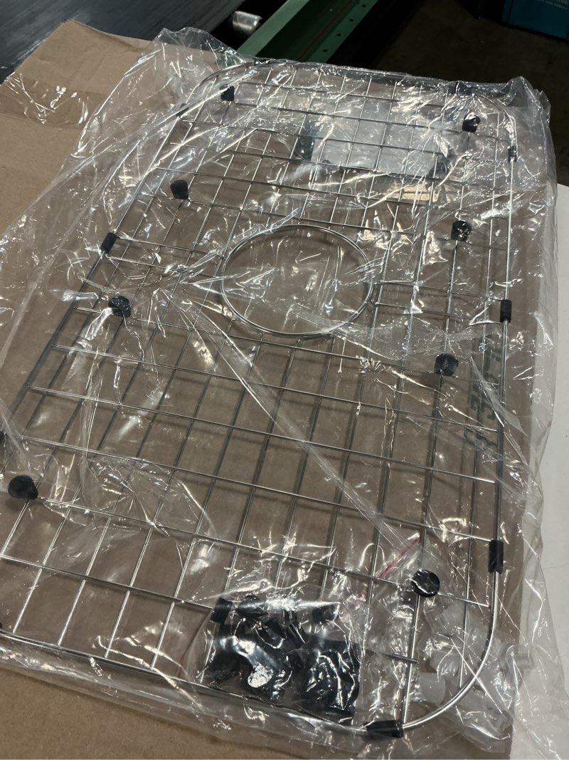 Condition photo showing Good Condition for serene valley sink protector grid 26-1/16" x 14-1/16", centered drain with corner radius 3-1/2", 304 stainless steel material nlw2614c