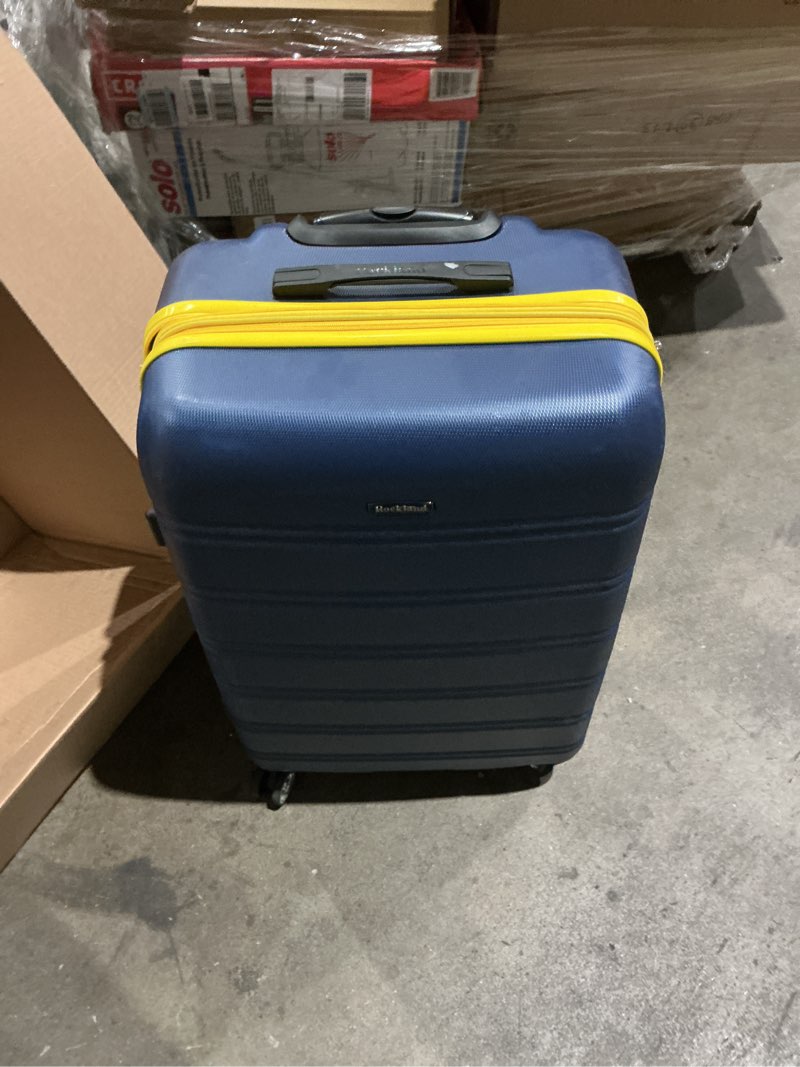 Condition photo showing As Is for rockland adult 1-piece solid print hardside checked luggage, blue