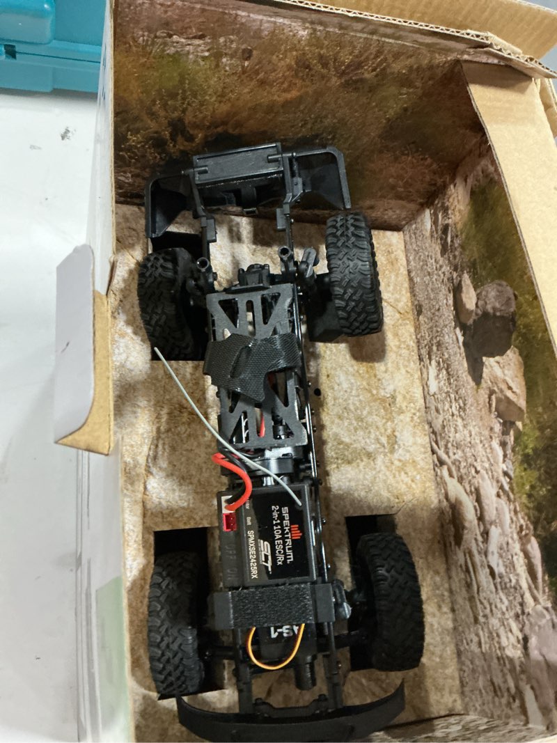 Condition photo showing As Is for Axial RC Truck 1/24 SCX24 Base Camp 4x4 Rock Crawler Brushed RTR(Everything Needed to Run is Included) - White, AXI-1219T1