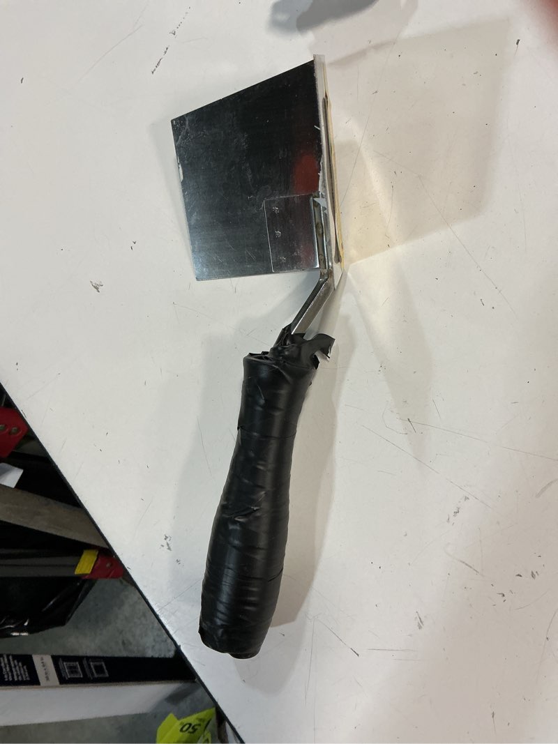 Condition photo showing As Is for wal-board tools 4-inches x 5-inches stainless steel inside corner drywall trowel
