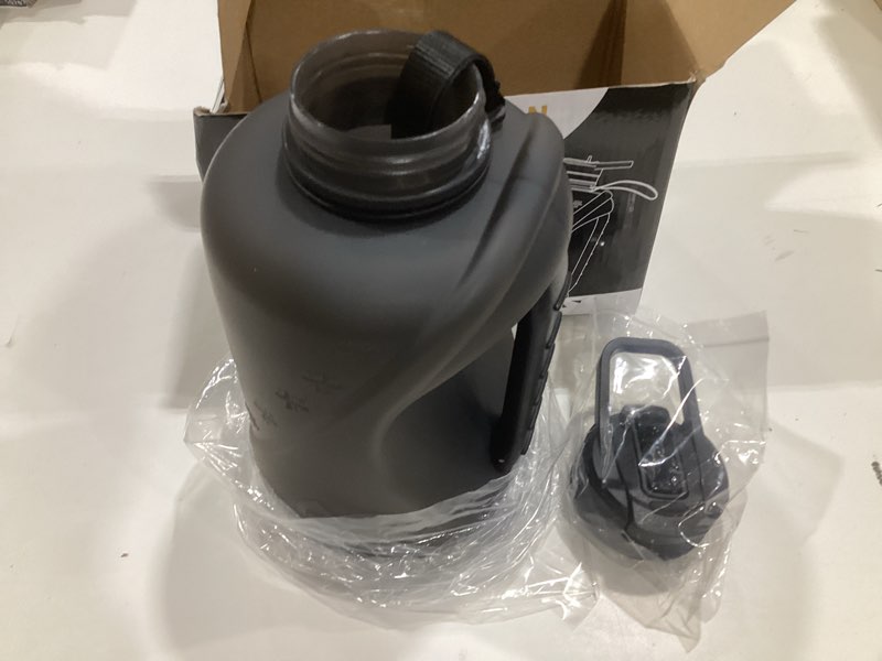 Condition photo showing Good Condition for half gallon water bottle with 2-in-1 straw lid?dishwasher safe?easy clean?bpa-free?durable solid no-slip handle for gym?work and outdoor sport black 74 ounces